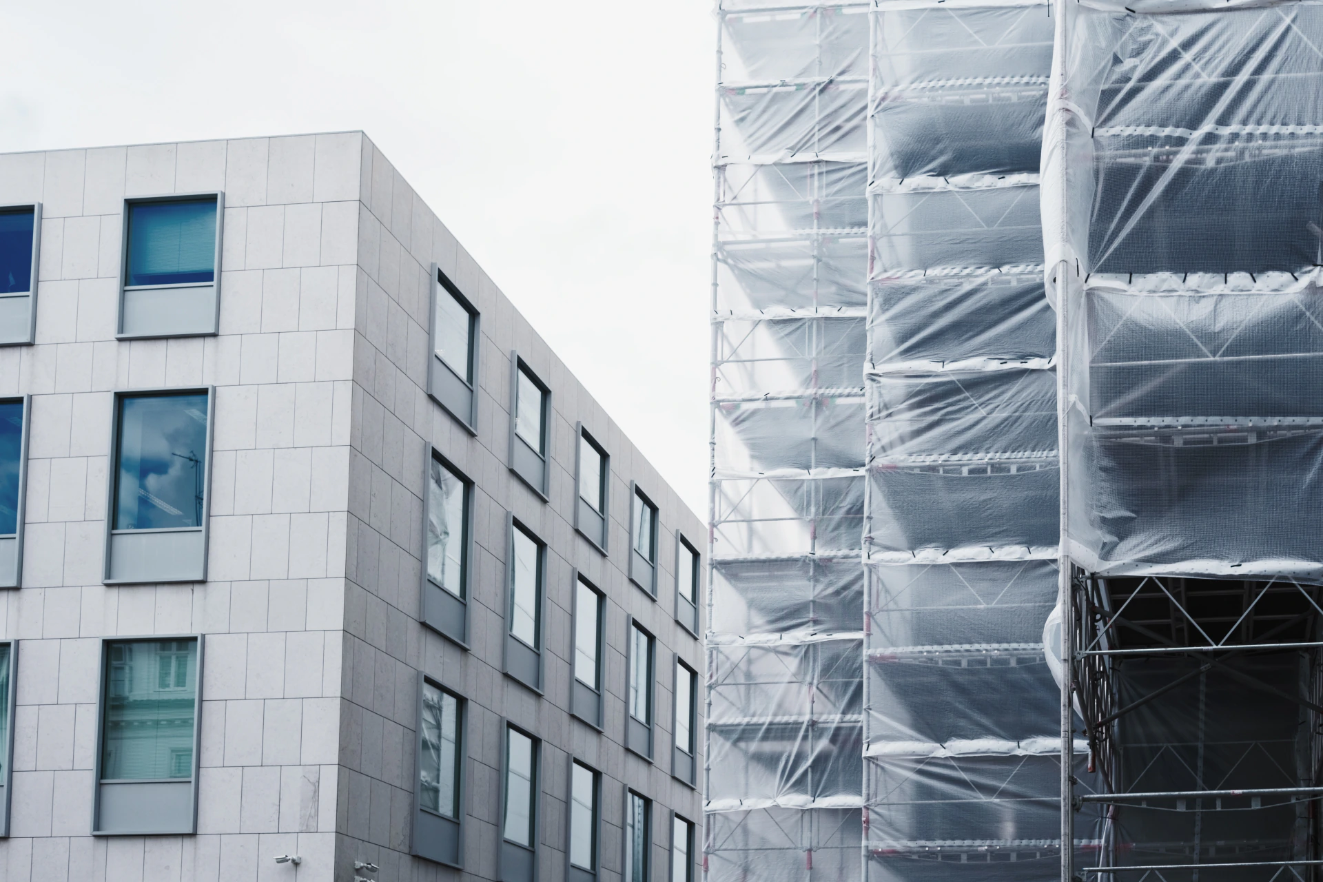 Building facade beside renovation scaffolding